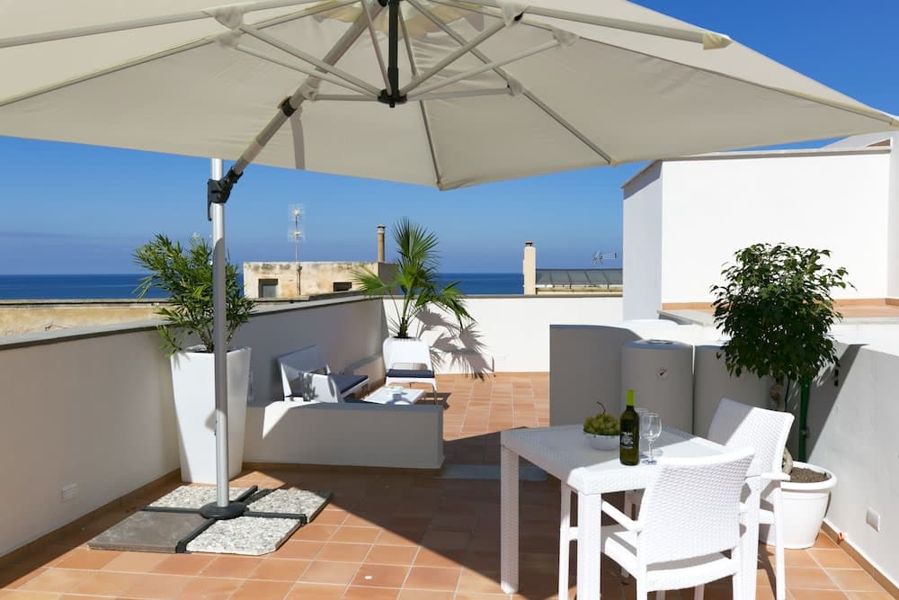 Covered patio with ocean view