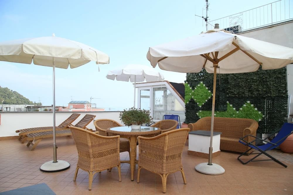 Covered patio with ocean view
