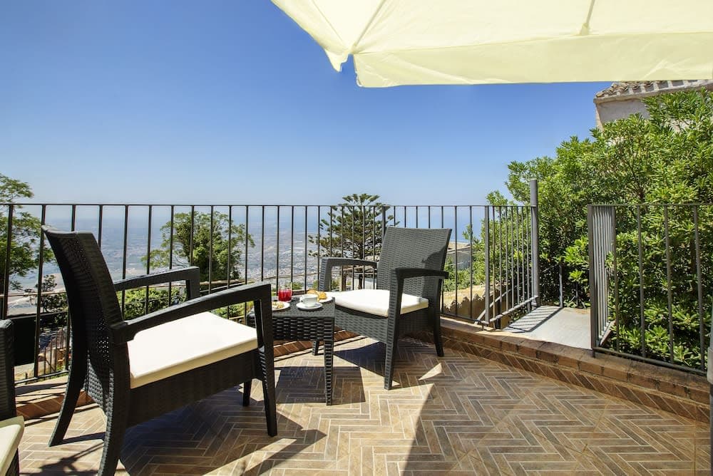 Covered patio with ocean view