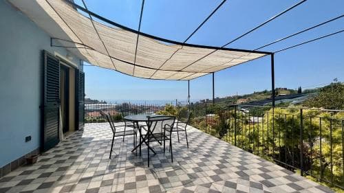 Covered patio with ocean view