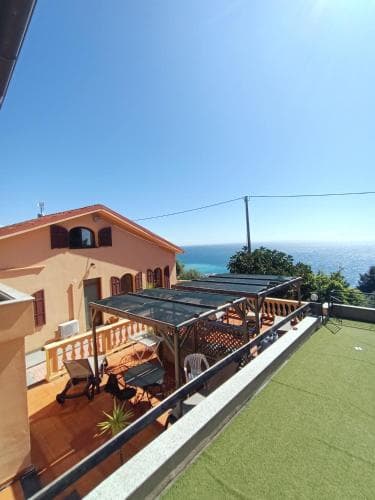 Covered patio with ocean view