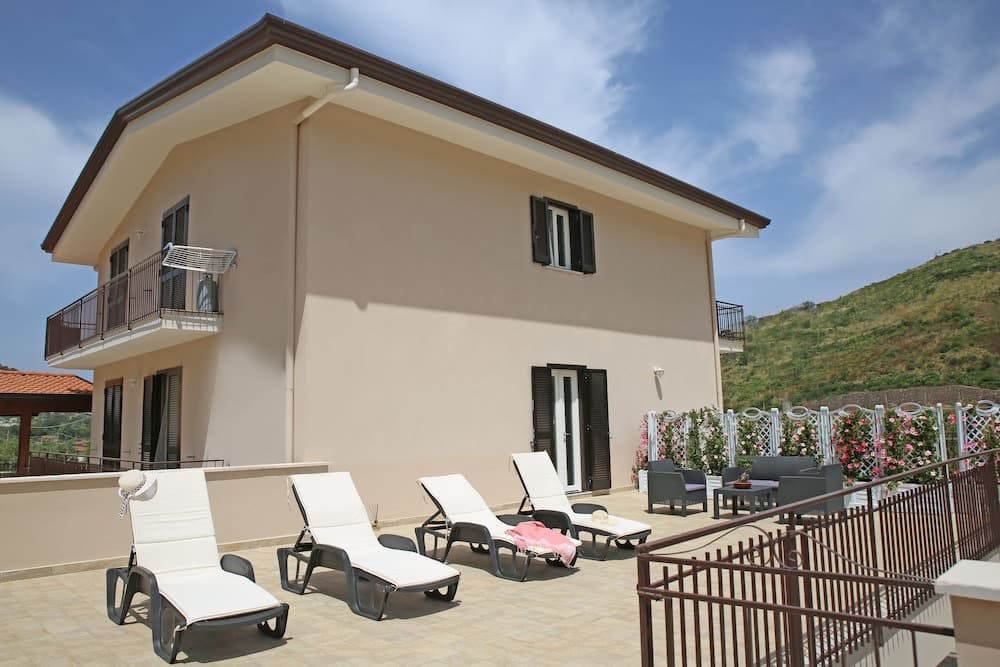 Covered patio with ocean view