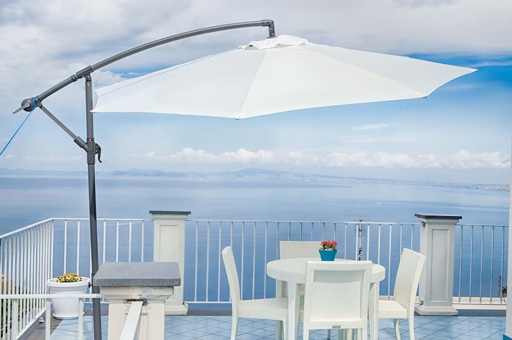 Covered patio with ocean view