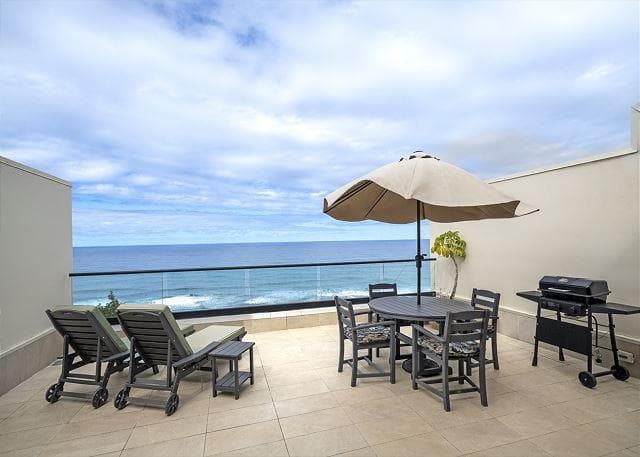 Covered patio with ocean view